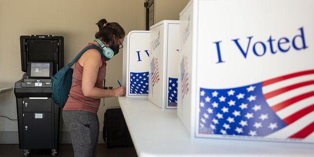 A voter casts a ballot at a polling location in Pittsburgh May 17, 2022. 