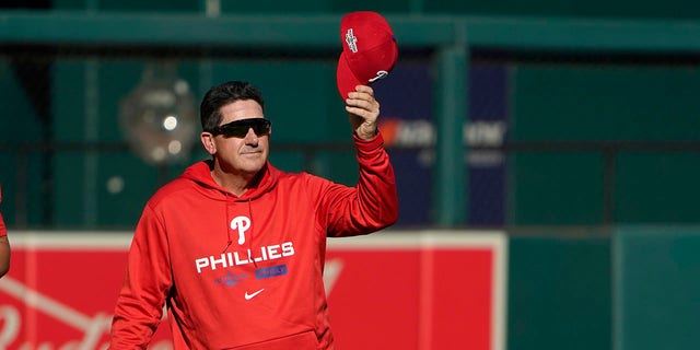 Philadelphia Phillies interim manager Rob Thomson removes his cap during baseball practice Thursday, Oct. 6, 2022, in St. Louis. The Phillies and St. Louis Cardinals are set to play Game 1 of a National League Wild Card baseball playoff series on Friday in St. Louis. 