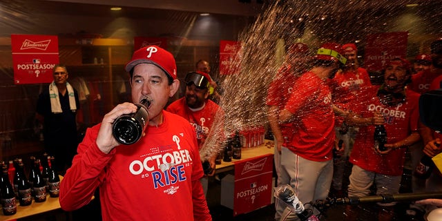 Philadelphia Phillies interim manager Rob Thomson celebrates after the Phillies won a baseball game against the Houston Astros to clinch a wild-card playoff spot, Monday, Oct. 3, 2022, in Houston.