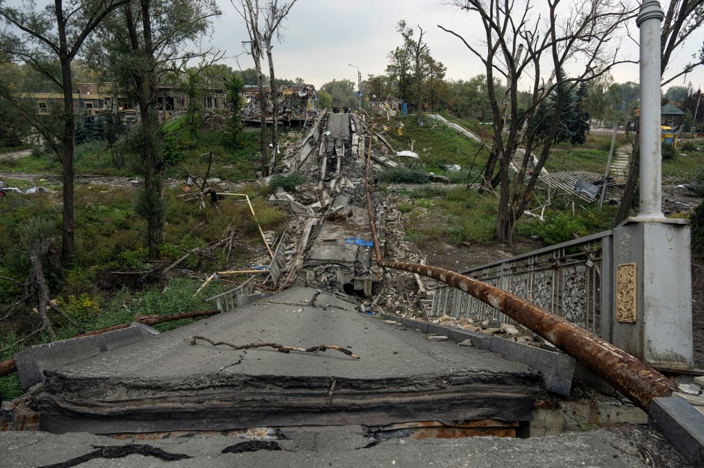 A destroyed bridge across Siverskyi-Donets river is seen in the recently liberated town of Izium on Oct. 2, 2022. 