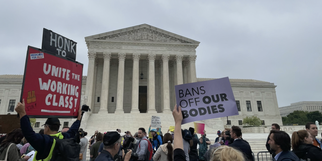 Protestors gather outside the Supreme Court to protest abortion rights.