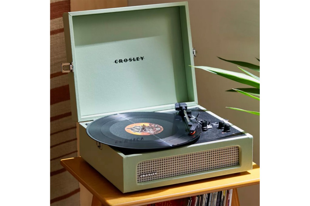 A mint green Crosley record player 