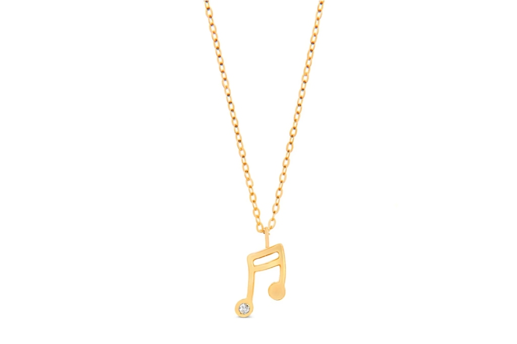 A gold music note necklace 