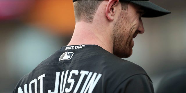 Shane Bieber of the Cleveland Indians sits in the dugout during the first inning against the Kansas City Royals at Progressive Field Aug. 23, 2019.