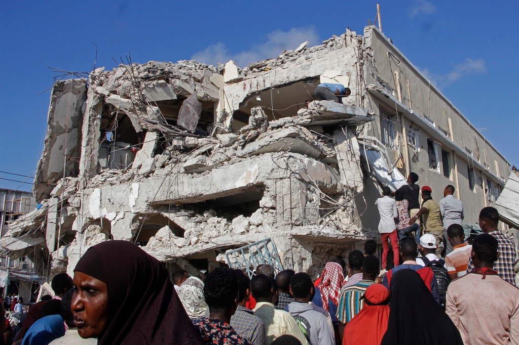 Building damage is assessed in the aftermath of the car bombs.