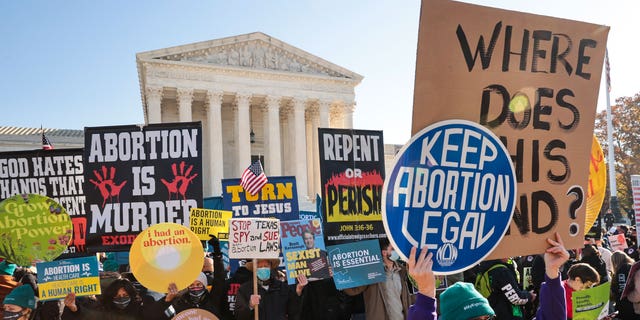 Demonstrators gather in front of the U.S. Supreme Court as the justices hear arguments in Dobbs v. Jackson Women's Health, a case about a Mississippi law that bans most abortions after 15 weeks, on Dec. 01, 2021 in Washington, D.C. 