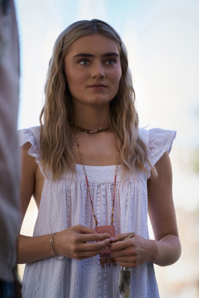 Meg Donnelly as Mary Winchester on "The Winchesters" smiling outside. 