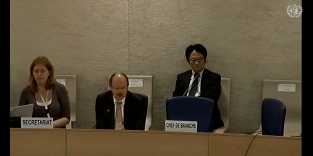 Eric Tistounet, chief of the United Nations Human Rights Council, sits beside Emma Reilly Sept. 21, 2012. 