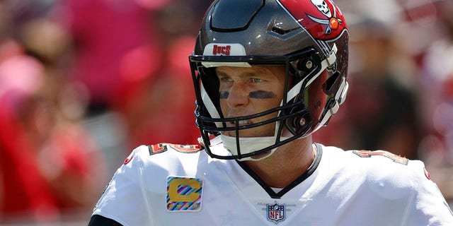 Tampa Bay Buccaneers quarterback Tom Brady, #12, works out prior to the game against the Atlanta Falcons at Raymond James Stadium in Tampa, Florida, Oct. 9, 2022.