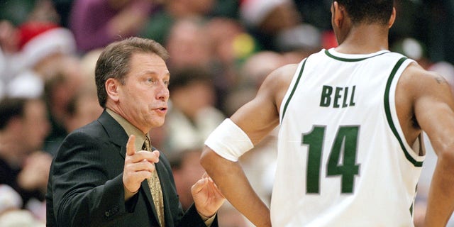 Head Coach Tom Izzo of the Michigan State Spartans talks to Charlie Bell, #25, during the game against the Kentucky Wildcats at the Breslin Center in East Lansing, Michigan.