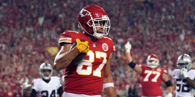 Travis Kelce #87 of the Kansas City Chiefs catches a pass in the endzone for a touchdown during the 1st half of the game against the Las Vegas Raiders at Arrowhead Stadium on October 10, 2022 in Kansas City, Missouri.