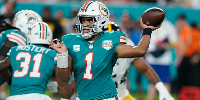 Miami Dolphins quarterback Tua Tagovailoa, #1, aims a pass during the first half of an NFL football game against the Pittsburgh Steelers, Sunday, Oct. 23, 2022, in Miami Gardens, Florida.