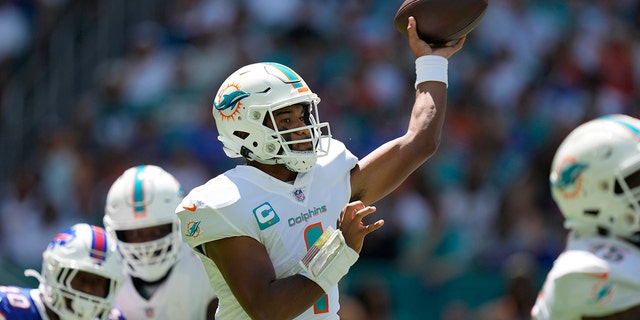 Miami Dolphins quarterback Tua Tagovailoa (#1) aims a pass during the first half of an NFL football game against the Buffalo Bills, Sunday, Sept. 25, 2022, in Miami Gardens. 