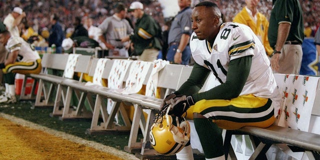 Tyrone Davis, #81 of the Green Bay Packers, sits on the bench dejected during Super Bowl XXXII against the Denver Broncos at Qualcomm Stadium in San Diego.