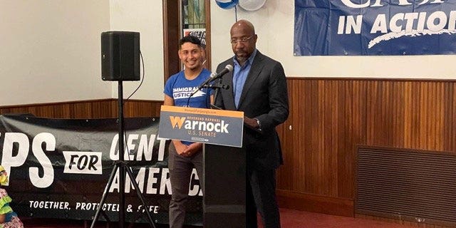 Democratic Georgia Sen. Raphael Warnock speaks to supporters at an Atlanta-area Methodist Church during a Hispanic Heritage Month celebration on October 12, 2022.