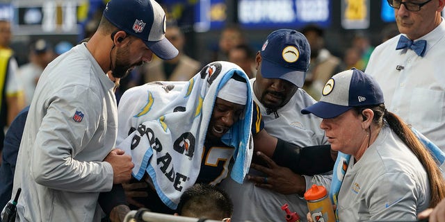 Los Angeles Chargers cornerback J.C. Jackson (27) reacts to an injury during the first half of an NFL football game against the Seattle Seahawks Sunday, Oct. 23, 2022, in Inglewood, Calif.