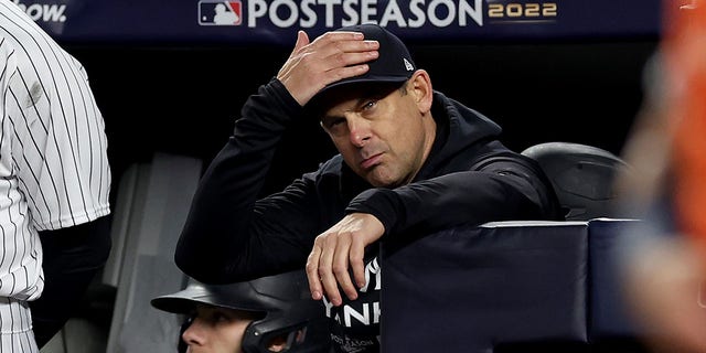 Manager Aaron Boone of the New York Yankees looks on from the dugout during the fifth inning against the Houston Astros in Game 3 of the American League Championship Series at Yankee Stadium Oct. 22, 2022, in New York City.