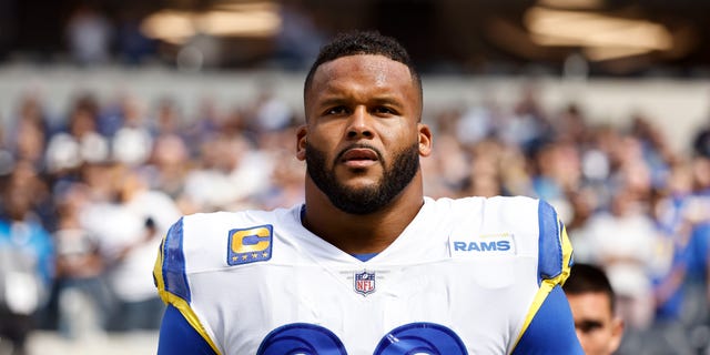 Aaron Donald of the Los Angeles Rams during the national anthem prior to a game against the Dallas Cowboys at SoFi Stadium Oct. 9, 2022, in Inglewood, Calif.