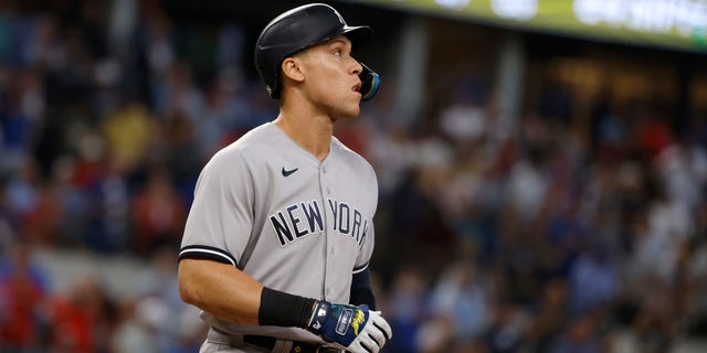 Aaron Judge of the New York Yankees looks toward the outfield after flying out against the Texas Rangers during the fifth inning in the first game of a doubleheader at Globe Life Field Oct. 4, 2022, in Arlington, Texas.