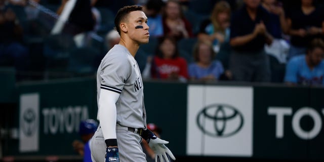 Aaron Judge of the New York Yankees reacts after hitting into a double play against the Texas Rangers during the third inning at Globe Life Field Oct. 3, 2022, in Arlington, Texas.