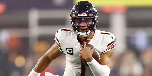 Justin Fields #1 of the Chicago Bears runs with the ball during the first half against the New England Patriots at Gillette Stadium on October 24, 2022 in Foxborough, Massachusetts.