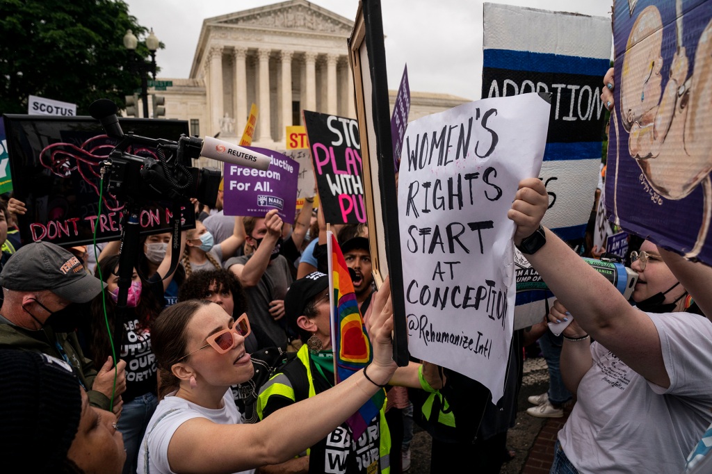 Abortion rights activists protest outside the Supreme Court.