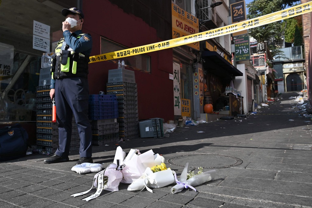 Flowers are laid at the scene of a Halloween stampede.