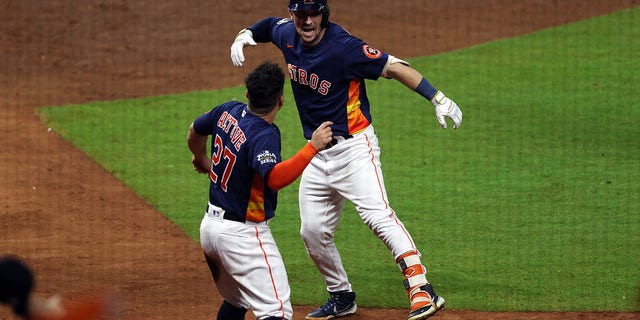 Alex Bregman #2 of the Houston Astros celebrates a two run home run with Jose Altuve #27 in the fifth inning against the Philadelphia Phillies in Game Two of the 2022 World Series at Minute Maid Park on October 29, 2022 in Houston, Texas.
