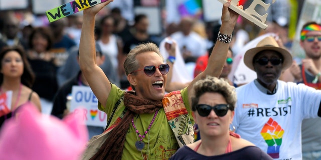 Marchers celebrate during the Los Angeles LGBTQ #ResistMarch, Sunday, June 11, 2017, in West Hollywood, California.