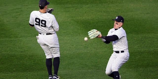 Harrison Bader #22 of the New York Yankees is unable to make the play on a fly ball in the second inning during Game 3 of the ALCS at Yankee Stadium on Saturday, Oct. 22, 2022, in New York, New York.