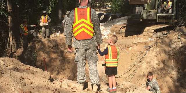 Benjamin Sternemann holds his son's hand in 2015.