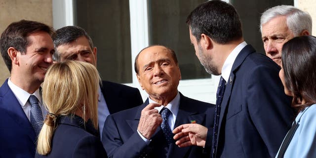 Giorgia Meloni of "Fratelli d'Italia" party, Silvio Berlusconi of "Forza Italia" party and Matteo Salvini of "Lega" political party, talk as they leave the Quirinale Palace