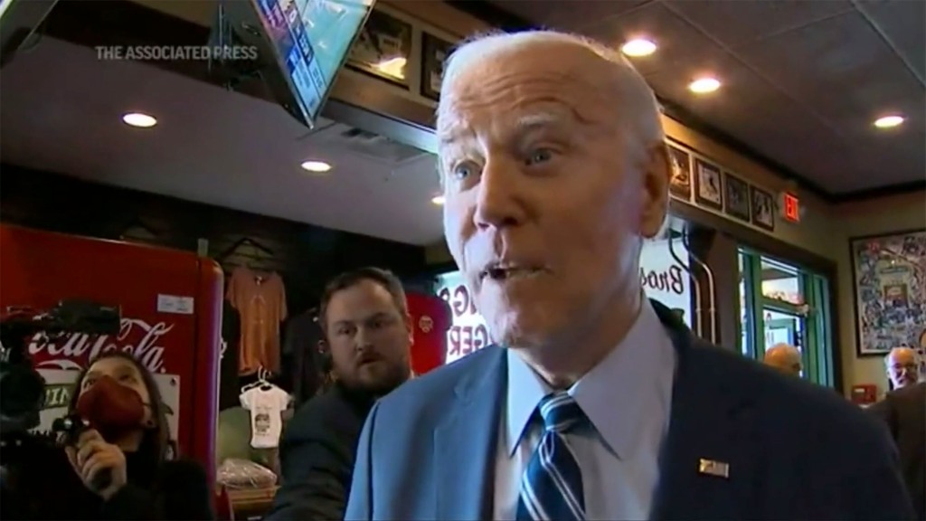 Biden goes up to a reporter asking questions during sandwich shop stop.