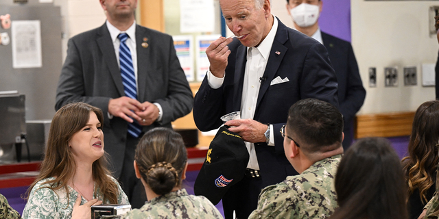 President Biden eats ice cream as he meets with members of the U.S. military and their families at the bowling alley at Osan Air Base in Pyeongtaek, South Korea, on May 22, 2022.