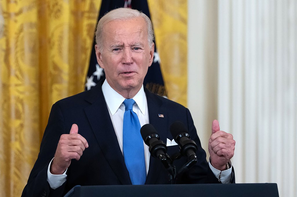 President Joe Biden gives a double thumbs up