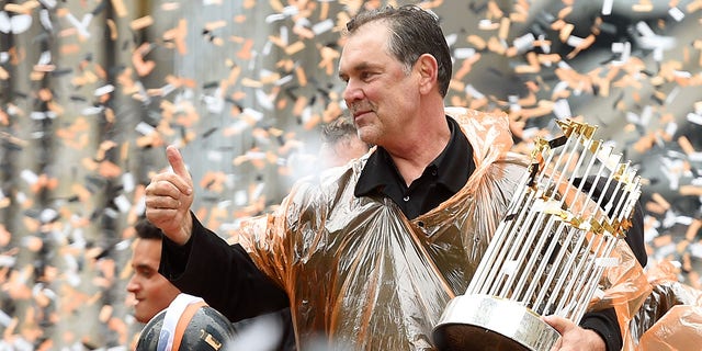 Manager Bruce Bochy of the San Francisco Giants waves to the crowd during the San Francisco Giants' World Series victory parade Oct. 31, 2014, in San Francisco, California. 