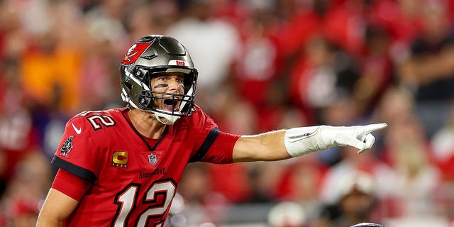 Tom Brady #12 of the Tampa Bay Buccaneers signals at the line of scrimmage against the Baltimore Ravens during the fourth quarter at Raymond James Stadium on October 27, 2022 in Tampa, Florida.