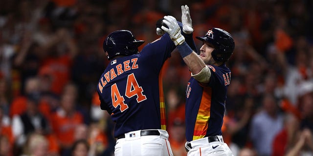 Alex Bregman #2 of the Houston Astros celebrates his three-run home run against the New York Yankees with Yordan Alvarez #44 during the third inning in game two of the American League Championship Series at Minute Maid Park on October 20, 2022, in Houston, Texas.