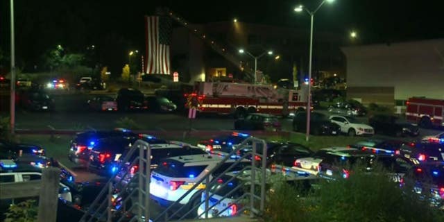 The scene outside a Connecticut hospital where one police officer is fighting for his life after two others were shot in Bristol.