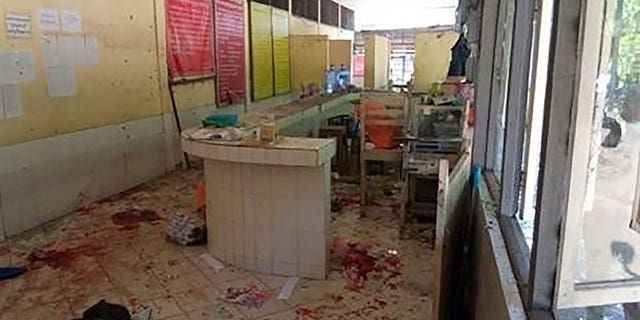 In this photo provided by the Military True News Information Team, a parcel-reception desk at the entrance of the Insein prison sits damaged after an explosion Wednesday, Oct. 19, 2022, in Yangon, Myanmar. A bombing on Wednesday near the front gate of Myanmar’s main prison for political detainees killed a number people, including visitors and prison personnel, local media and the government said.