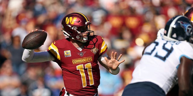 Carson Wentz #11 of the Washington Commanders throws the ball during the third quarter against the Tennessee Titans at FedExField on October 09, 2022 in Landover, Maryland.