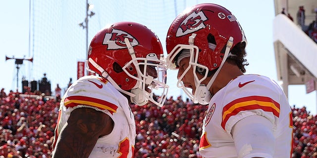 Mecole Hardman #17 celebrates with Patrick Mahomes #15 of the Kansas City Chiefs after catching a touchdown in the first quarter against the San Francisco 49ers at Levi's Stadium on October 23, 2022, in Santa Clara, California. 