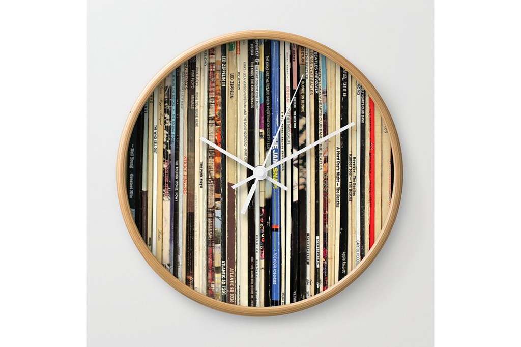 A clock made of classic rock record albums 