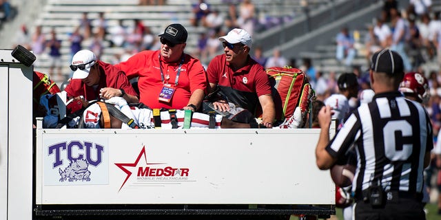 Defensive back Damond Harmon (17) of the Oklahoma Sooners is carted off of the field after sustaining an injury during the second half of Oklahoma's road game against TCU at Amon G. Carter Stadium Oct. 1, 2022, in Fort Worth, Texas.