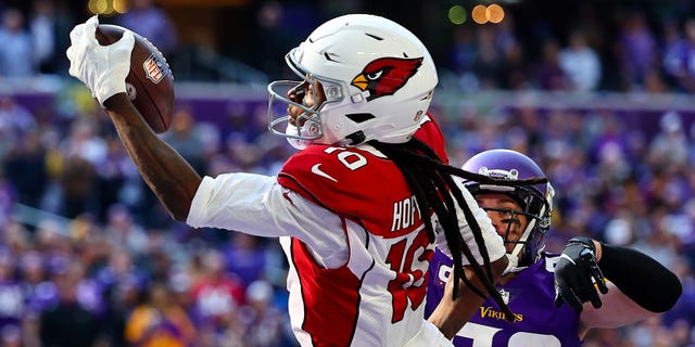 DeAndre Hopkins of the Arizona Cardinals catches the ball for a touchdown against the Minnesota Vikings at U.S. Bank Stadium on Oct. 30, 2022, in Minneapolis.