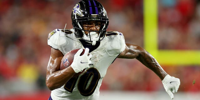 Demarcus Robinson #10 of the Baltimore Ravens carries the ball against the Tampa Bay Buccaneers during the third quarter at Raymond James Stadium on October 27, 2022 in Tampa, Florida. 