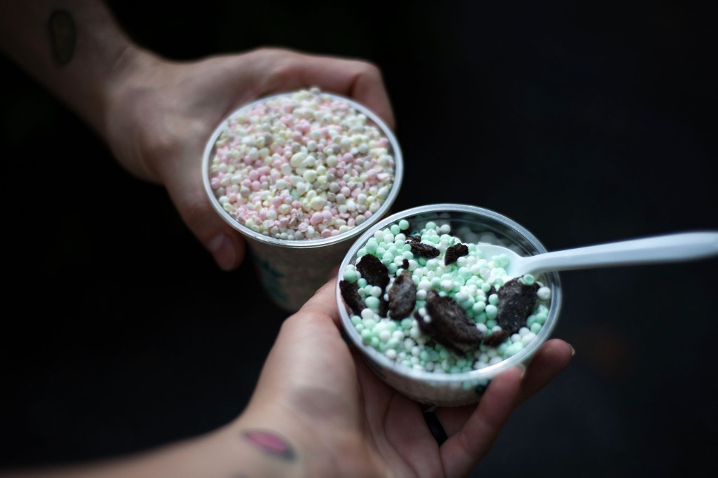 Hands with Tattoo Holding Dippin Dots Ice Cream