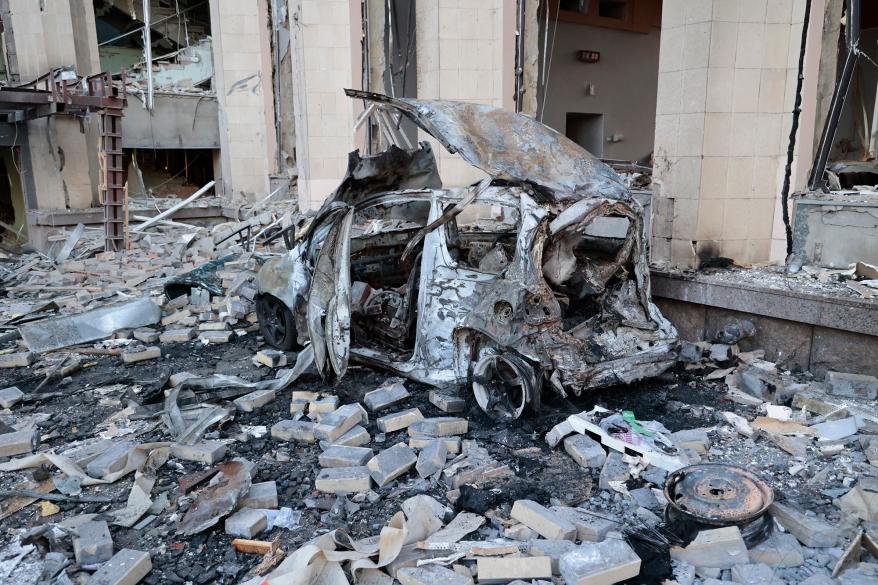 A destroyed car outside of the administrative building after the strike.