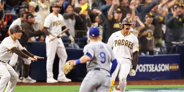 San Diego Padres right fielder Juan Soto (22) hits s game-tying single in the 7th inning against the LA Dodgers in Game 4 of a League Division Series at Petco Park in San Diego, Calif., Saturday, Oct. 15, 2022.