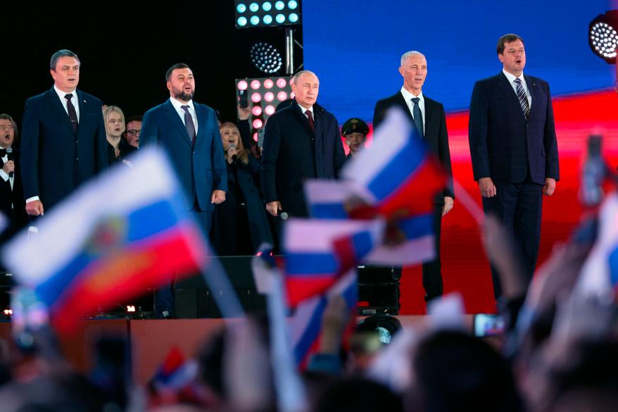 Putin, center, speaks as Leonid Pasechnik, leader of self-proclaimed Luhansk People's Republic, left, Denis Pushilin, leader of self-proclaimed of the Donetsk People's Republic, second left, Moscow-appointed head of Kherson Region Vladimir Saldo, second right, and Moscow-appointed head of Zaporizhzhia region Yevgeny Balitsky, right, stand near him during the rally.